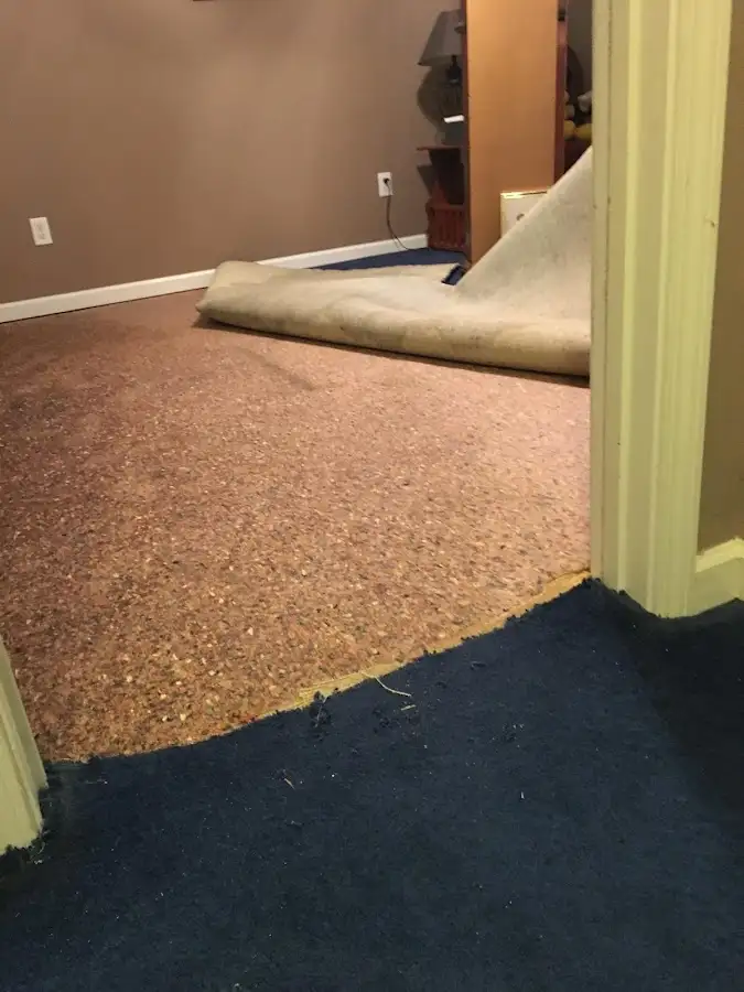 Carpet pad removal revealing water damage during Water Mitigation Services in Milton-Freewater